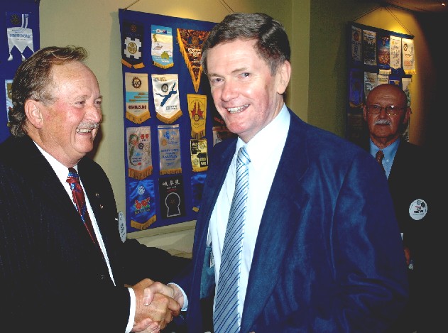 The Rotarian who made it happen, Peter Smith with Mike Bailey. MC Bert Houston is in the background